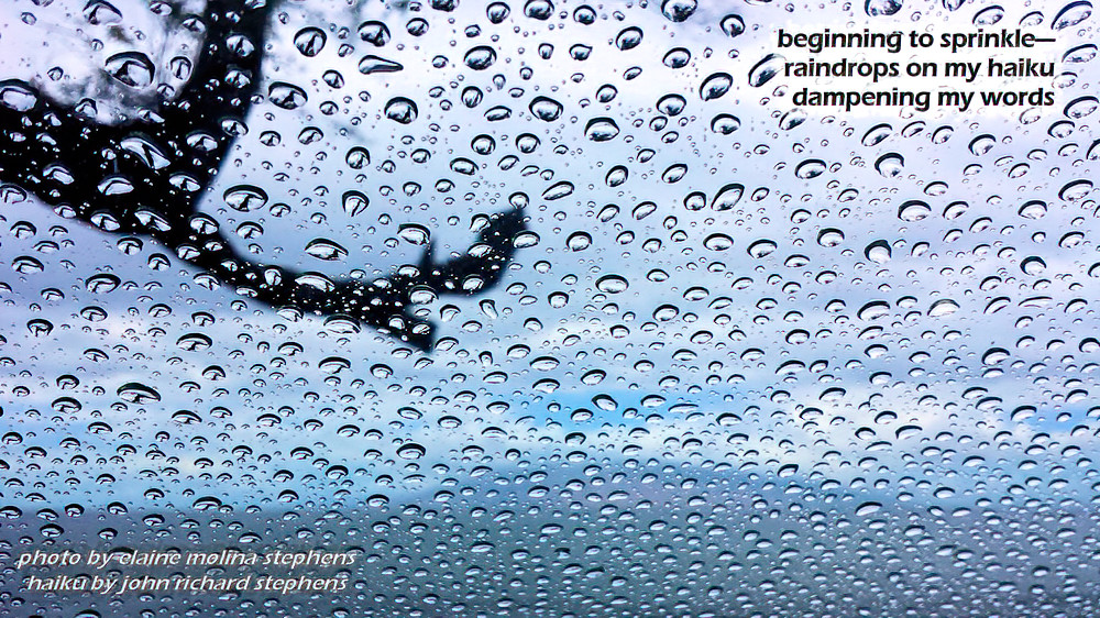 A photo haiku with a picture water drops on glass.